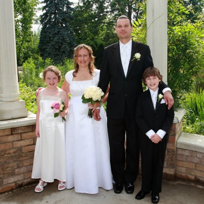 My mom, step-dad, and I alongside cake 16