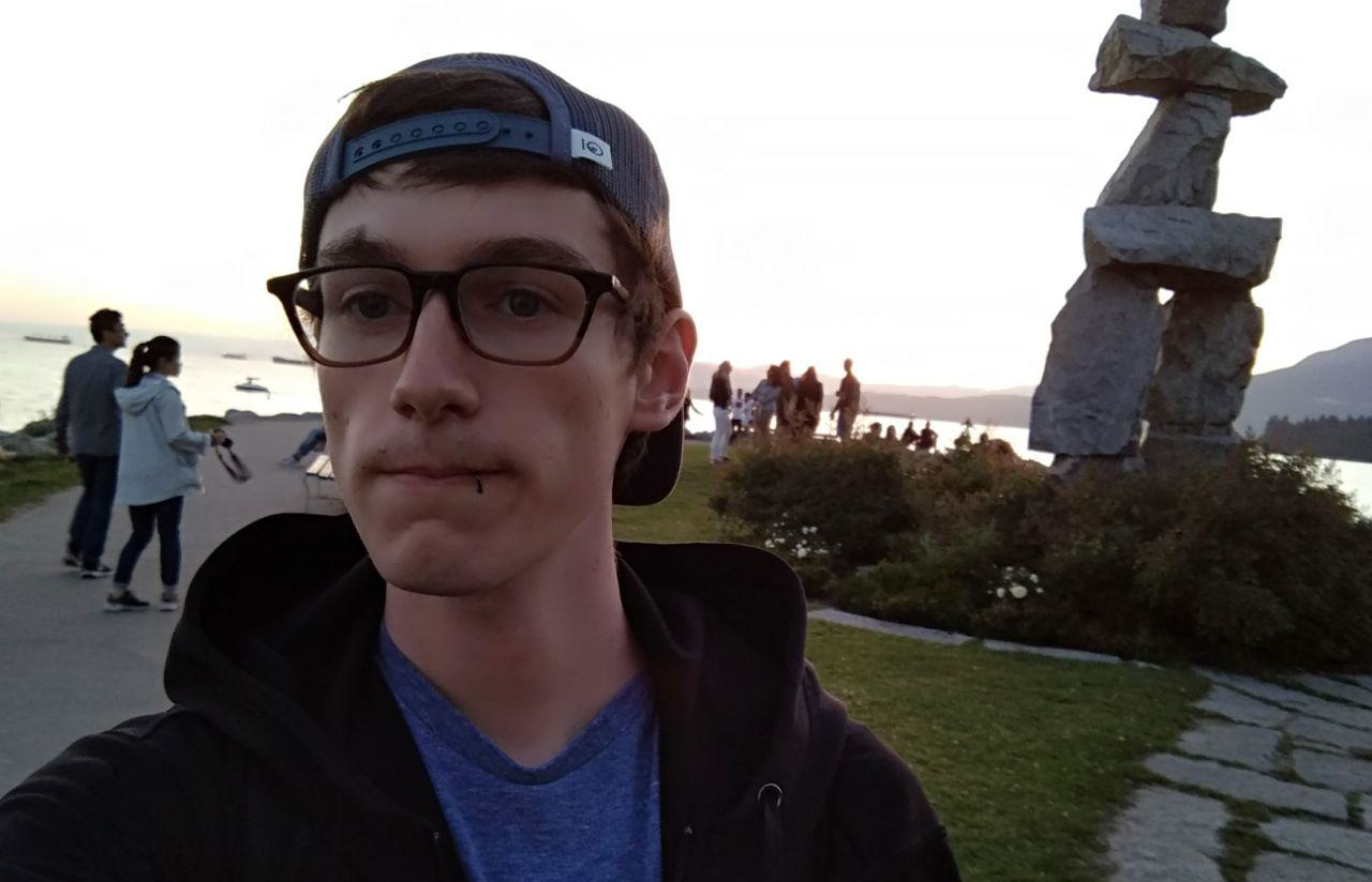 selfie in front of an Inukshuk in Vancouver